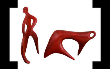 Two abstract mid-century vintage red carved fine art sculptural figurines of people and animals
